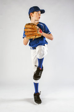 Young baseball player preparing to throw a pitch