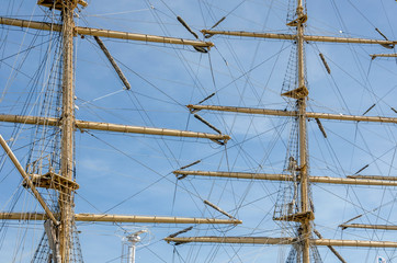 Mast sailing ship against a blue sky