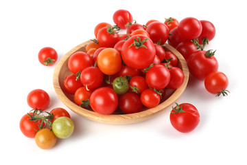 Red cherry tomatoes on wooden plate
