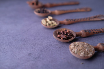 Close up of cooking ingredient and herbs on spoon 