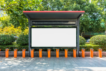 Blank billboard at bus stop in city of China.