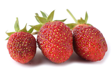 Three strawberries isolated on white