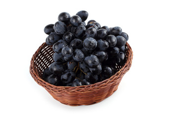 Black grape on wicked plate