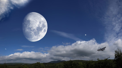 Hills, blue sky, Moon and planets. Summer. Panorama