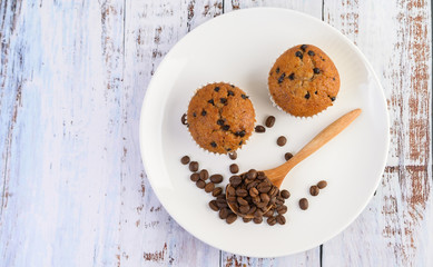 Banana cupcakes mixed with chocolate chip on a white plate.