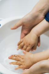 Asian mothers washing hands for infants