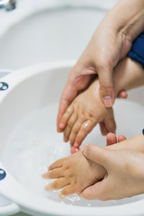 Asian mothers washing hands for infants