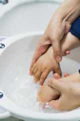 Asian mothers washing hands for infants