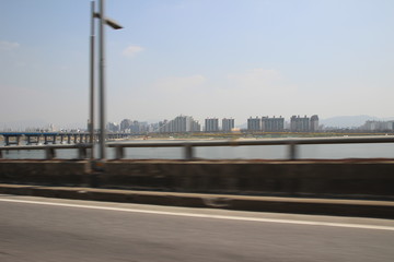 Fototapeta na wymiar A riverside city in Korea, shot on the road