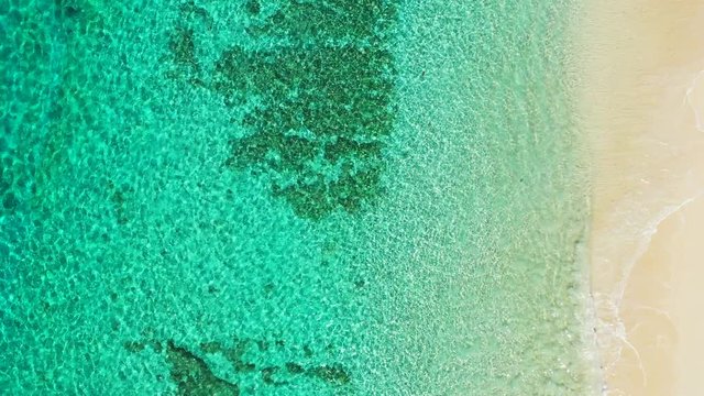 Aerial tropical abstract background. Tupai Heart Island Coral Reef Atoll In French Polynesia. Emerald sea water background
