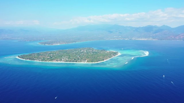 Gilli air island and Lombok on a foggy day. aerial seascape, tropical vacation and island hopping concept