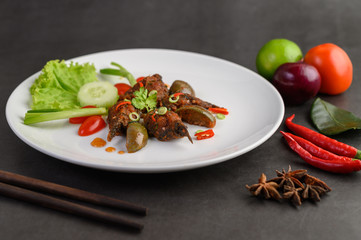 Spicy Fried Stir Catfish on white plate, Thai food.