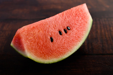 Sliced ​​watermelon on a wooden table.