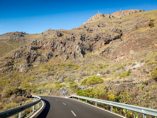 Beautiful image of narrow mountain road making turn