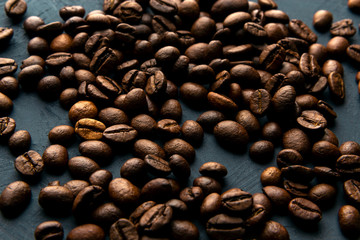 A lot of coffee beans on a blue background