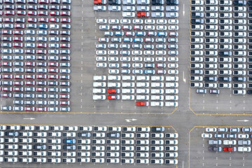 Aerial view of new cars stock at the port for import and export.Transportation and automobile concept