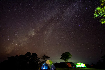 milky way over tent camping on mountain