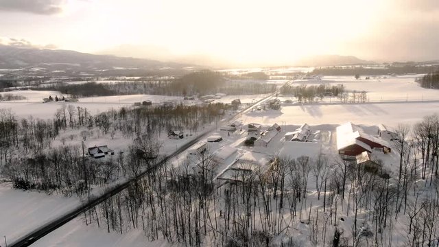 4K drone footage of snowy rural villages and roads in the ski resort town of Niseko, Japan.