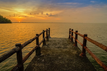 view seaside on the bridge with the sea and yellow sun light in the sky background, sunrise at Laem Hin Khon View Point, Mu Ko Phetra National Park, Satun, Thailand.