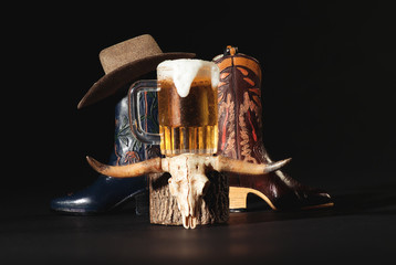 Blue and Tan Cowboy Boots, Mug of Beer, Animal Skull, Cowboy Hat