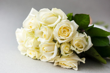 Beautiful white roses on a light background