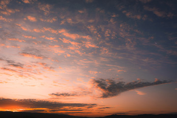 Sunrise with Crescent Moon on a Cloudy Winter Day