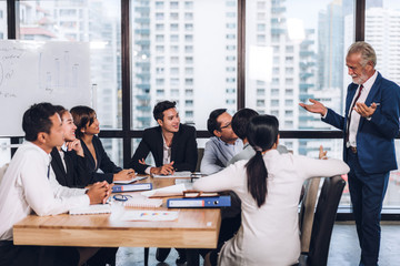 Group of professional business meeting and discussing strategy management with new startup project.Creative business people planning and brainstorm with document report in modern workloft.Teamwork 