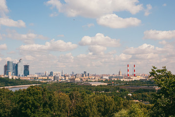 Fototapeta na wymiar A long aerial panorama of Moscow with the Moscow city complex under construction on the left and the Luzhniki stadium on the right. 2009 year