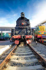 Image of old soviet steam locomotive on the rails