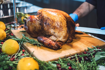 Chef carving roasted turkey for Thanksgiving