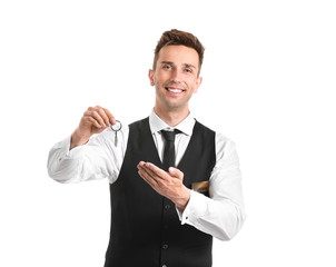 Portrait of hotel receptionist with room keys on white background