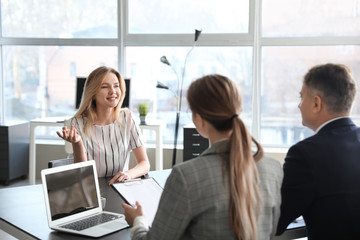 Human resources commission interviewing woman in office