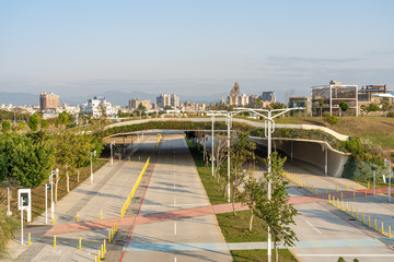 Street view of Shuinan Economic and Trade Area in blue sky sunny day. Former Shuinan Airport, lot of green space in here. Xitun District, Taichung City, Taiwan