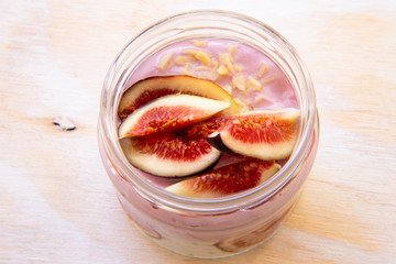 Healthy Chia pudding with yogurt, figs, oats in the jar