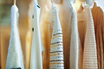 Closeup on clothes on hangers