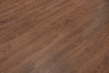 Fototapeta premium Natural dark brown wooden surface floor texture background. polished laminate parquet