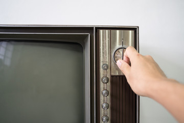 Hand switching on analog old retro television