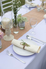 Outdoor catering dinner at the wedding with homemade garnishes decoration