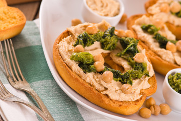 Friselle with turnip tops and hummus.