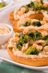 Friselle with turnip tops and hummus.