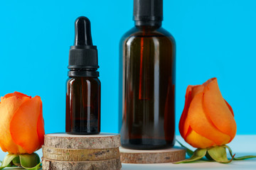 Cosmetics containers decorated with orange rose petals