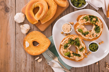 Friselle with turnip tops and hummus.