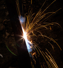 sparks from metal welding at a construction site