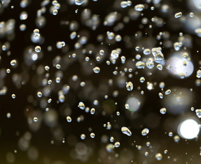 Water splashing from a fountain on summer nature