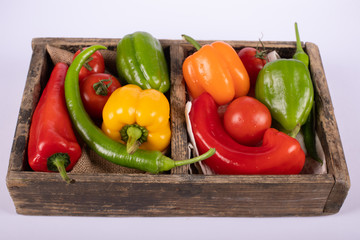 Color pepper wooden tray in white background