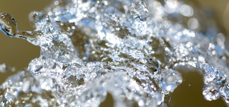 Water Splashing From A Fountain On Summer Nature