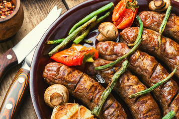 Sausages fried with vegetable