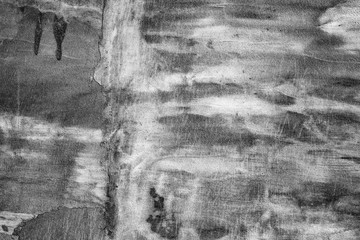Texture of a concrete wall with cracks and scratches which can be used as a background