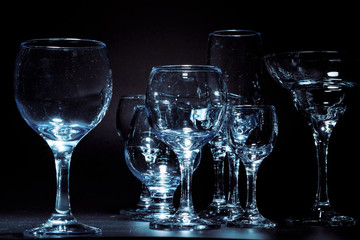 Empty  glasses for drinks on dark background