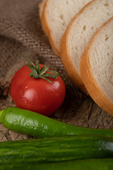 Tomato, chili peppers and bread slices.